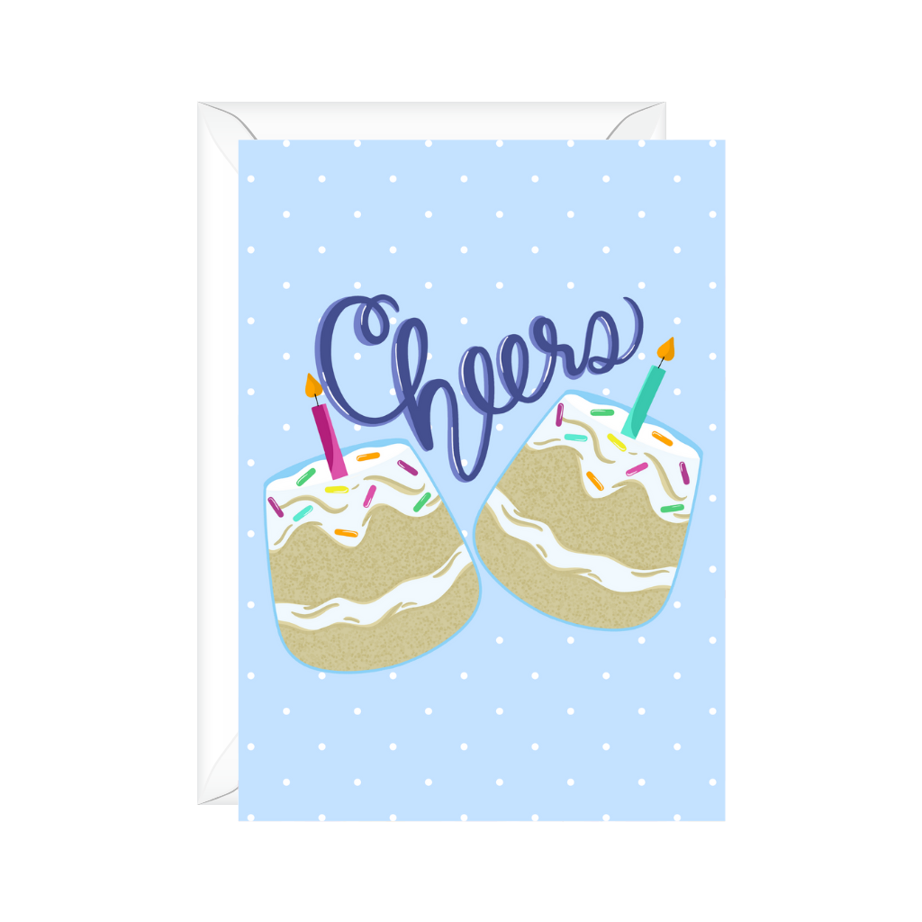 Light Blue background greeting card with white polka dots and two glasses filled with birthday cake and candle toasting cheers to celebrate birthday